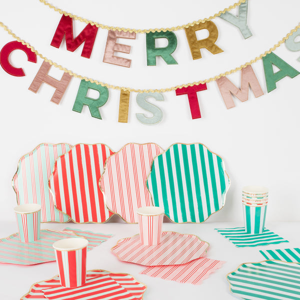 Our Christmas party set includes striped paper plates, cups and napkins, and a luxury velvet garland.  Image1
