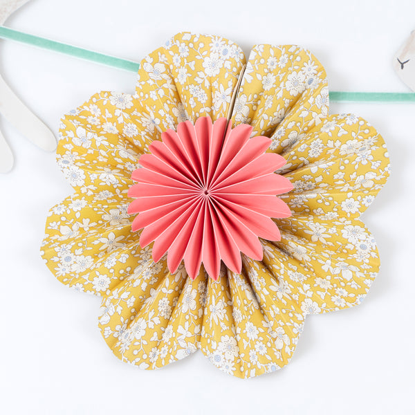 Our Easter decoration set includes 2 paper garlands with Liberty floral design flower pinwheels and scalloped shapes, and Easter bunnies. Image4