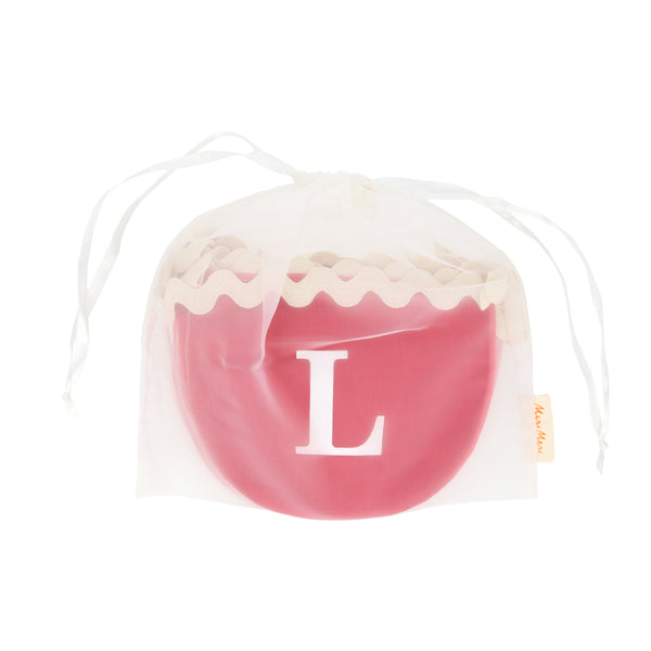 Our Valentine's decoration, a fabric garland, has scalloped pennants in red and pink with a romantic message. Image5