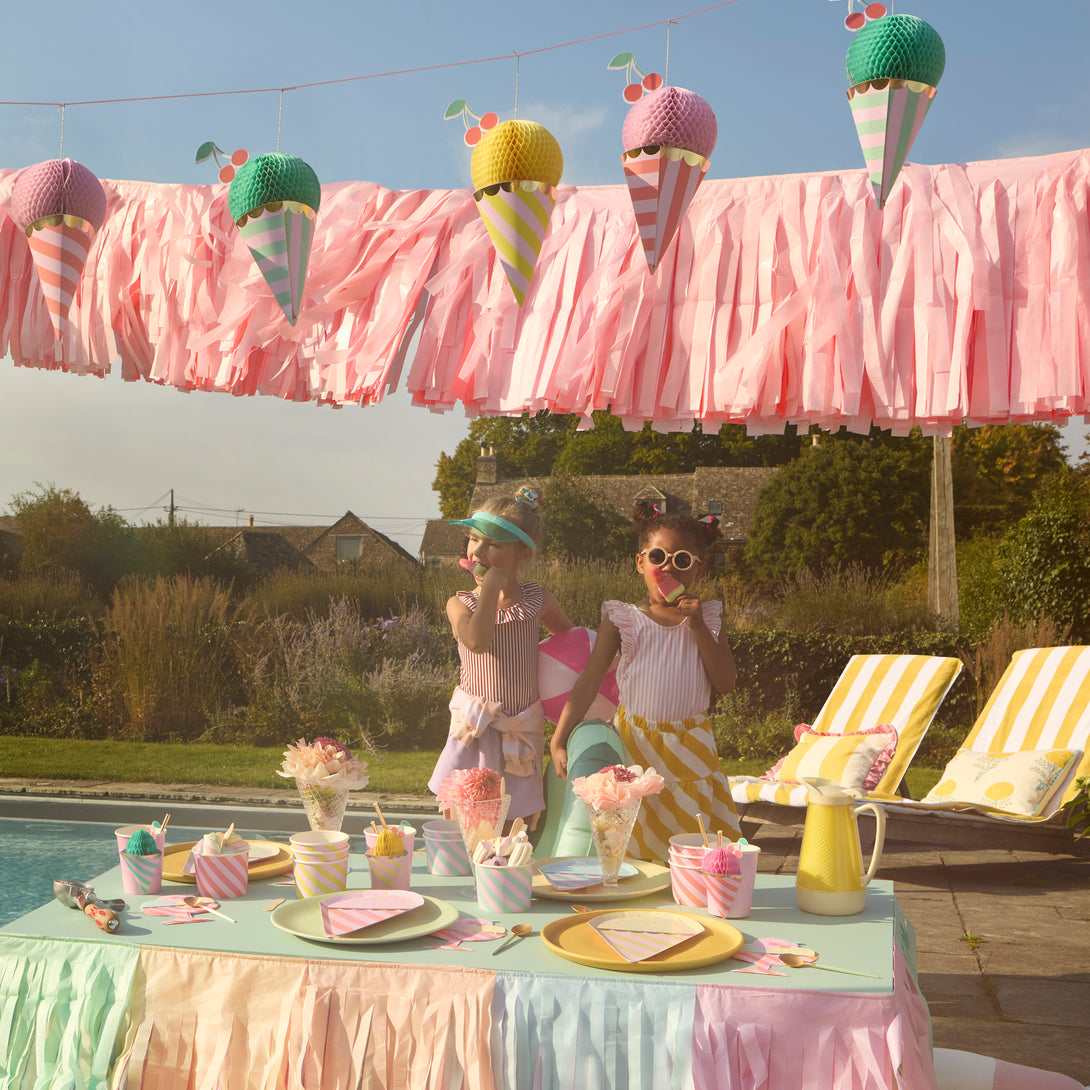 Our fringe garland, made of pink tissue paper, is ideal as a princess party decoration, or for baby showers, bridal showers or fairy parties.