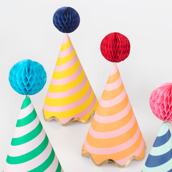 Our party accessories include hats with stripes and pompoms for a fun look. Image3