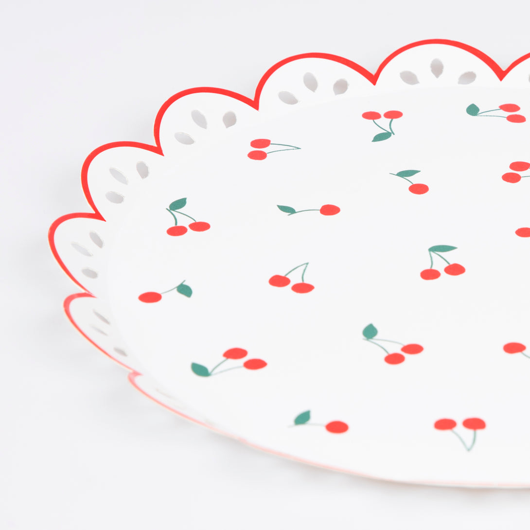 Our white and red paper plates feature a cherry design and broderie anglaise feel, perfect for a summery look.