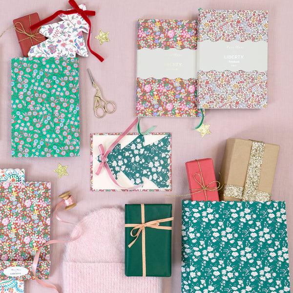 Our Christmas card set features 10 tree shaped cards with 5 different Liberty print designs, topped with velvet ribbon bows for a stylish look. Image2