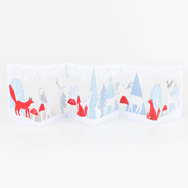 Our concertina card for Christmas opens up to show a winter woodland scene with animals, funghi and foliage, a beautiful decoration. Image2