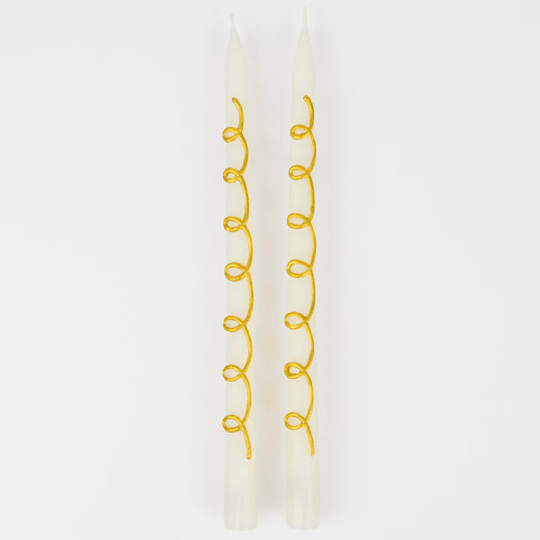 Our taper candles, with a gold swirl design, are perfect as Christmas decorative candles. Image5