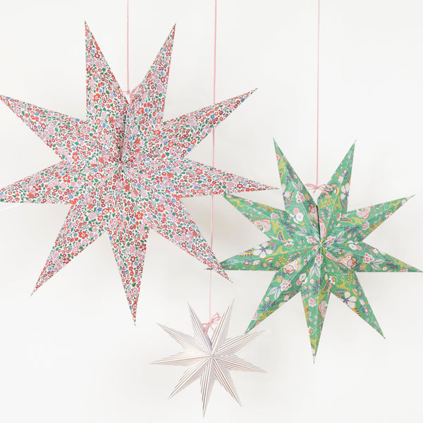 Our Christmas hanging decorations, in the shape of stylish 3D stars, feature beautiful Liberty floral prints in festive colours. Image1