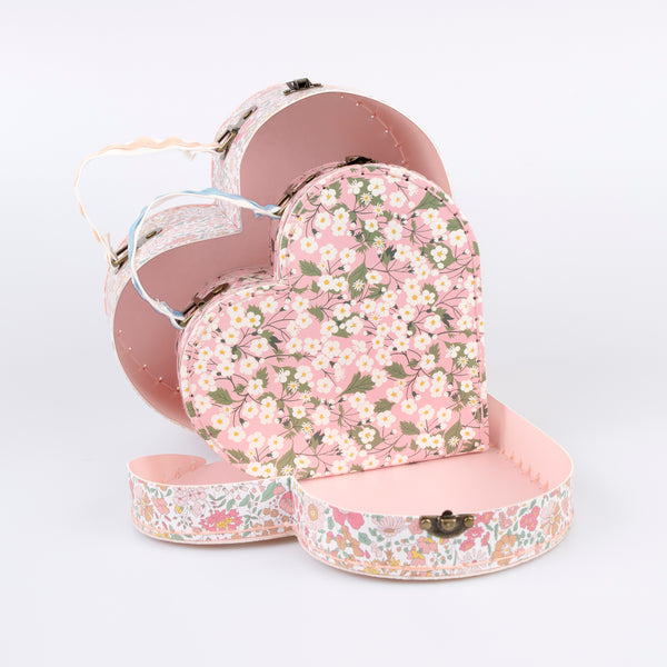 Our mini suitcases feature pretty Liberty floral prints in pink tones, fabulous for kids aged 3+ and adults, for travel and storage. Image1