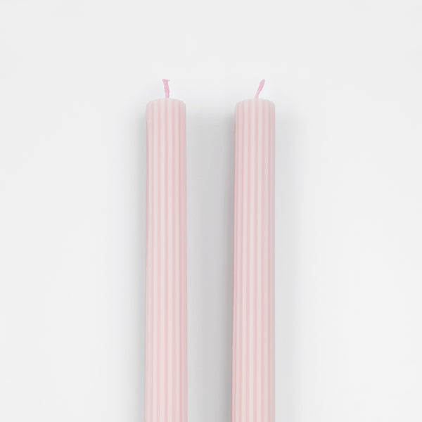 Our tall candles, in a pink colour with ridged details, add a stunning look to any party. Image3