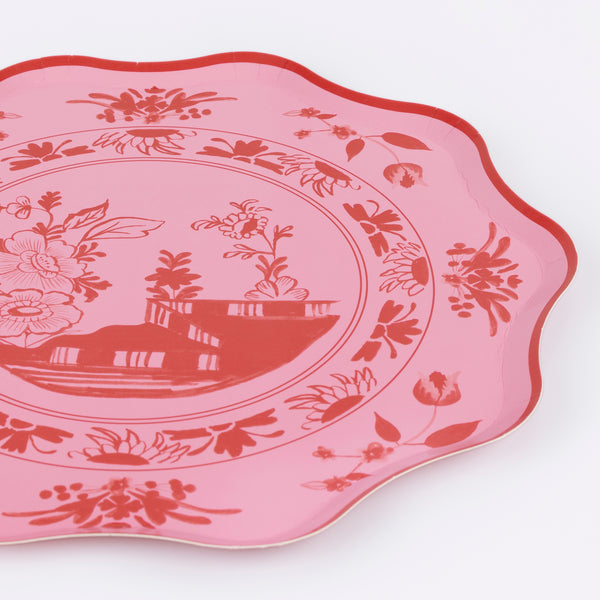 Our pink plates, made from high-quality paper, feature a bridge and botanical illustration in bright pink, with a soft pink background. Image2