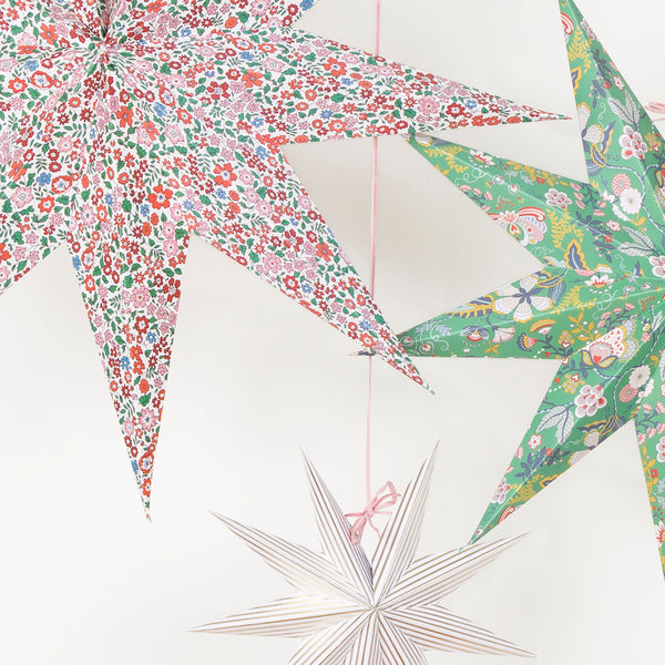 Our Christmas hanging decorations, in the shape of stylish 3D stars, feature beautiful Liberty floral prints in festive colours. Image3