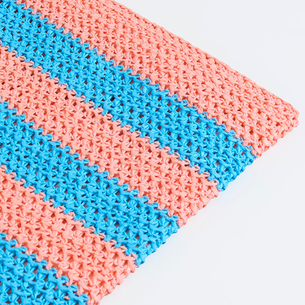 Our raffia bag, made from paper based raffia with pink and blue stripes, and an orange border, has the word Happy embroidered on the front. Image4