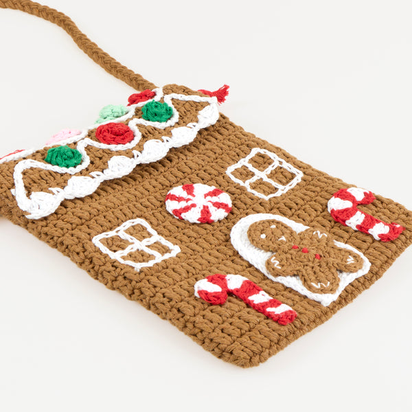 Our Christmas bag, in a shoulder bag style, is made with crochet in a gingerbread house design, a great accessory gift. Image4