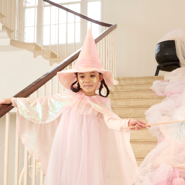 Our pink witch hat is made with iridescent pink sequin fabric and pink tulle for a shimmering, stylish Halloween costume. Image1