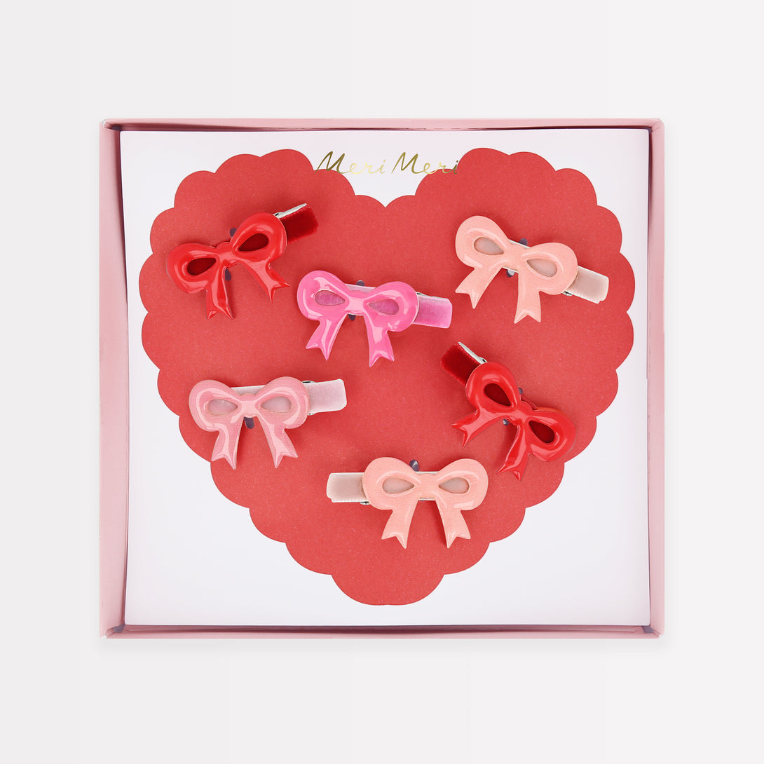 Our luxury red and pink hair clips feature enamel bows and velvet ribbons - the perfect Valentine's hair accessories for kids.