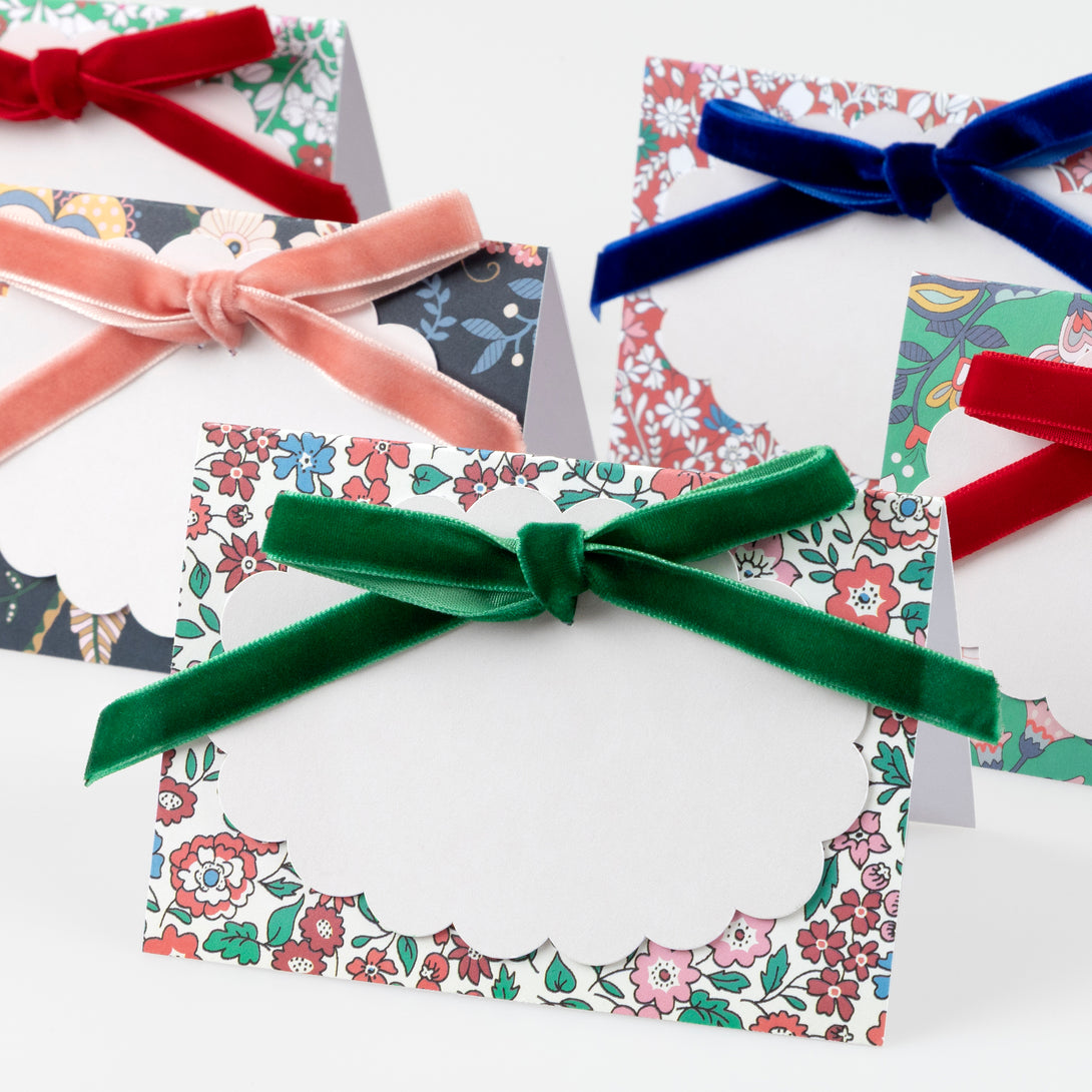 Our Christmas  place cards feature joyful Liberty prints, soft velvet bows, matt gold foil details and scalloped paper cards to write the names on. Image3
