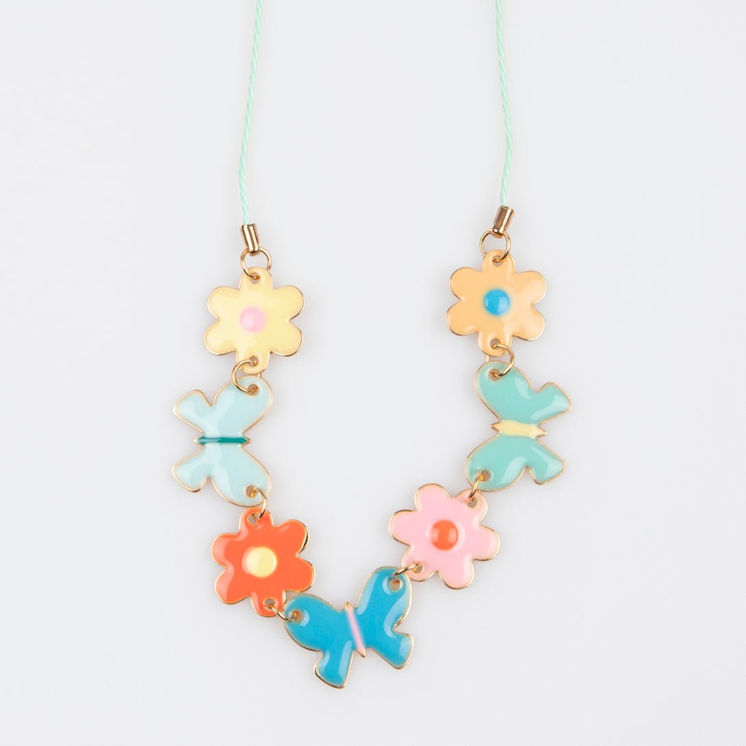 Our springtime charm necklace features enamel butterflies and flowers, a delightful gift.