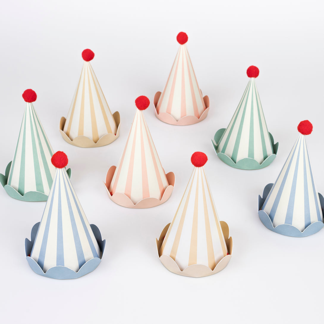 Our paper hats feature pastel stripes, fun red pompoms and scalloped details, they're ideal as birthday party hats for ages 3+.