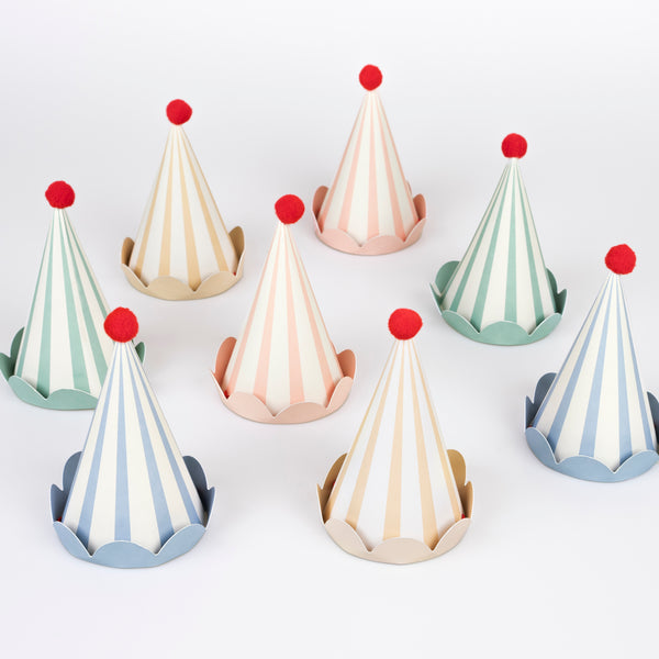 Our paper hats feature pastel stripes, fun red pompoms and scalloped details, they're ideal as birthday party hats for ages 3+.