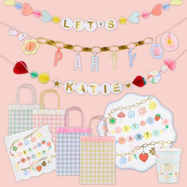 Our special party set feature colourful charm illustations with pops of gold foil, with tableware and party bags for eight and stylish decorations. Image1