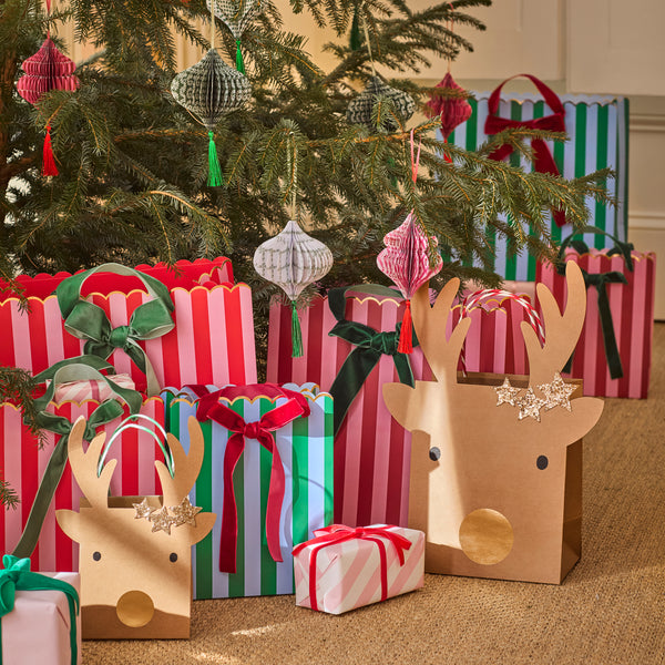 Our Christmas gift bags, made from premium paper, feature vibrant stripes in festive colours with velvet bows and velvet handles. Image2
