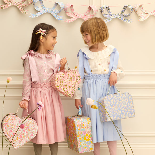 Our mini suitcases feature pretty Liberty floral prints in pink tones, fabulous for kids aged 3+ and adults, for travel and storage. Image2