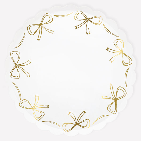 Add our stylish paper dinner plates to your Christmas party supplies, the gold bow design and scalloped border are so elegant. Image1
