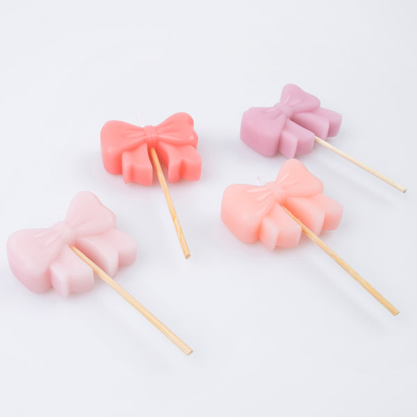 Make your birthday cake look so on-trend with our bow birthday candles. Image4