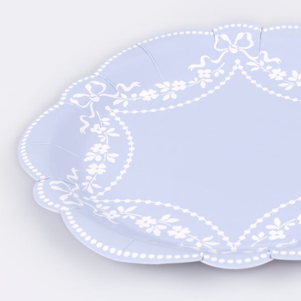 Our paper plates, made in a cornflower blue shade with white ornate patterns, are ideal as baby shower plates or for any special meal. Image2