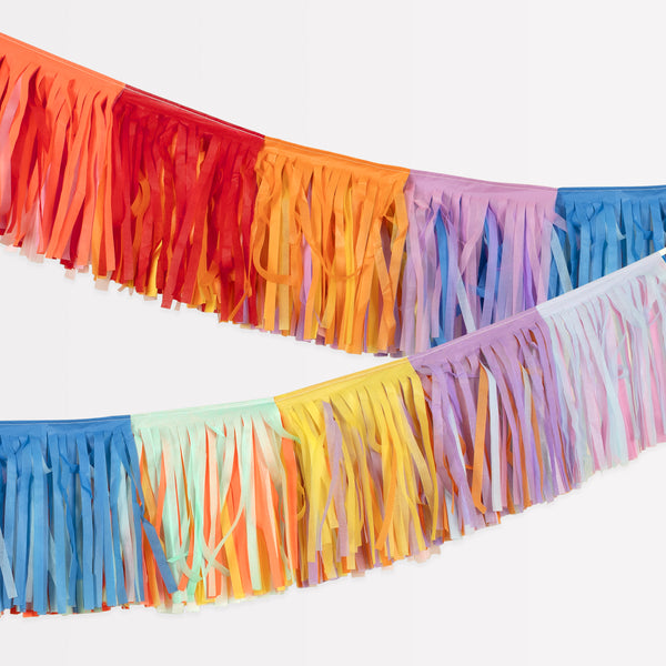 Our colourful garland, create with tissue paper fringes, adds brightness and texture to party walls and tables.