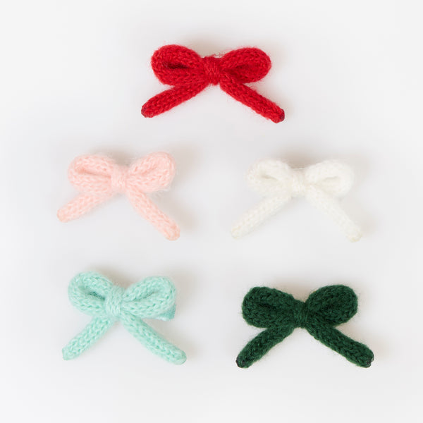 Our Christmas hair clips feature knitted bows and velvet ribbon details in red, pink, white, mint and green, for a wonderfully stylish look. Image2