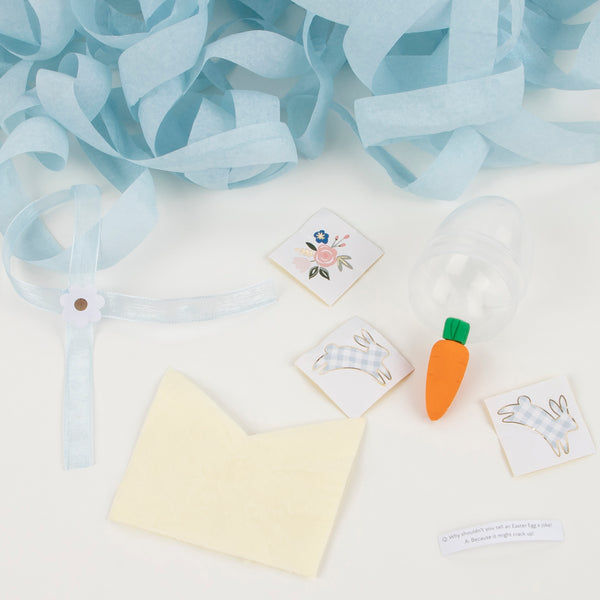Our plastic Easter eggs are filled with Easter treats including a party hat, foiled stickers and a carrot shaped eraser. Image4