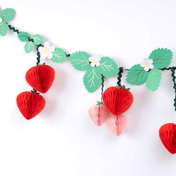 Our strawberry party set includes summery party supplies with strawberry designs, including plates, cups, napkins and a garland.  Image3