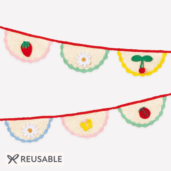 Our crochet garland features scalloped pennants with colourful designs, presented in an organza drawstring bag, a beautiful decoration. Image1