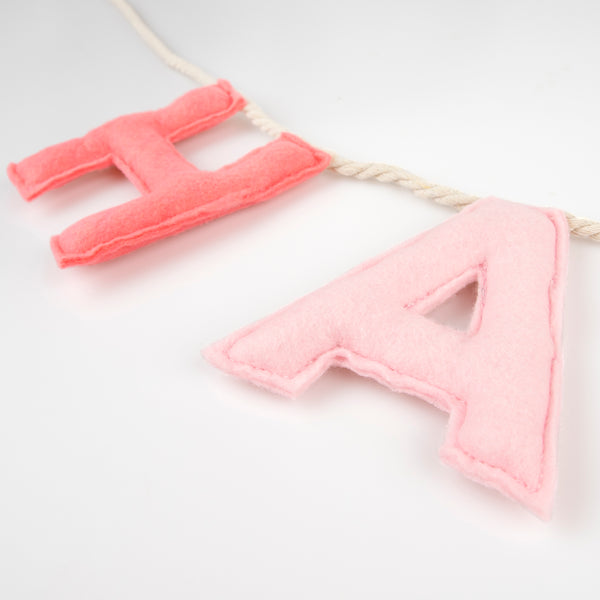 Our happy birthday garland has felt letters in peach and pink tones, ideal to reuse year after year. Image2