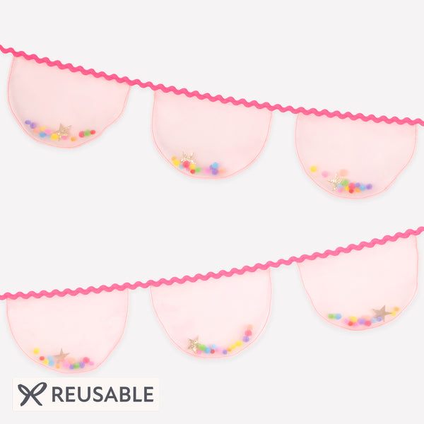 Our fabric garland, made from pink organza with lots of fun pompoms and glitter fabric stars, is the ideal princess party garland. Image1