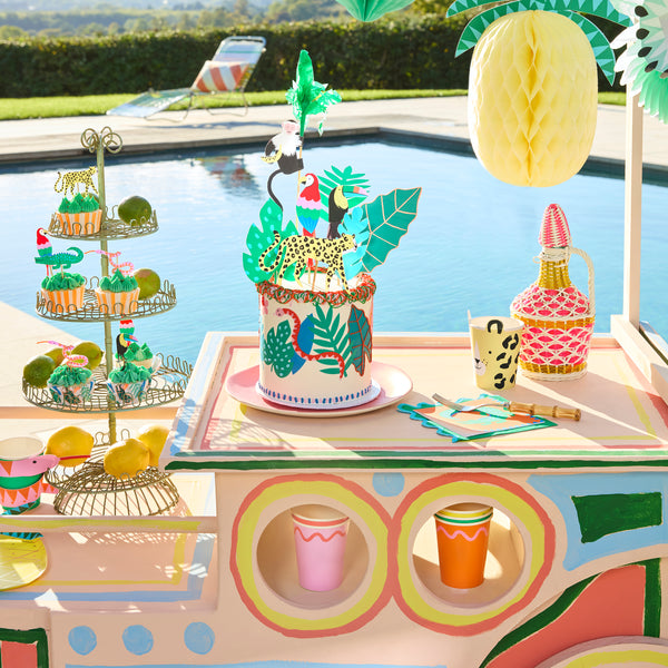 Our jungle cupcake kit features 24 rainforest animal cake toppers and 24 vibrant cupcake cases, perfect for a jungle party. Image2