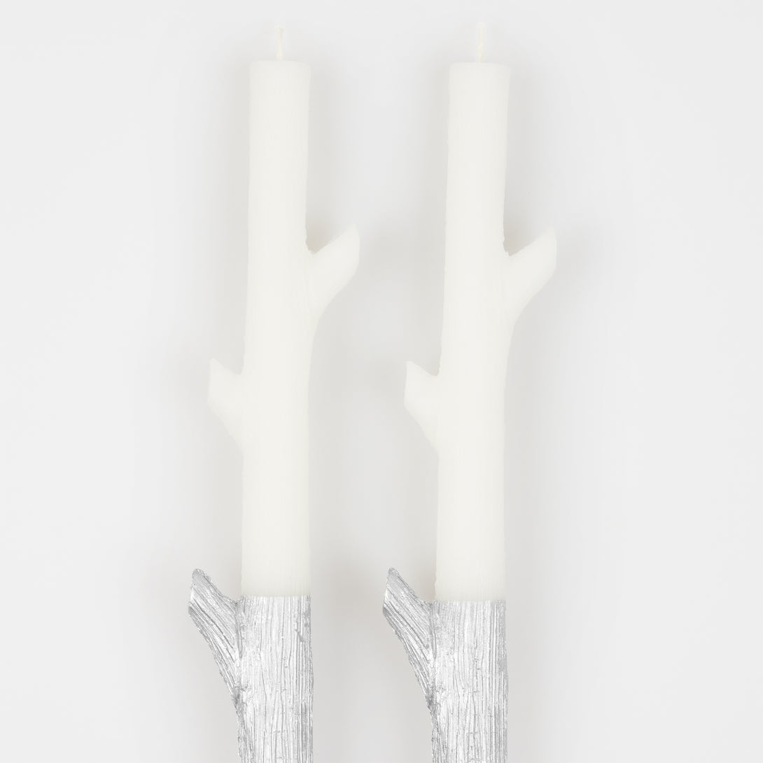 Our tall candles, shaped like sticks and dipped in silver ink, will look amazing as Halloween or Christmas table decorations.