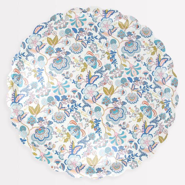 Our wooden round tray has a scalloped edge, floral Liberty print design, and a melamine finish.