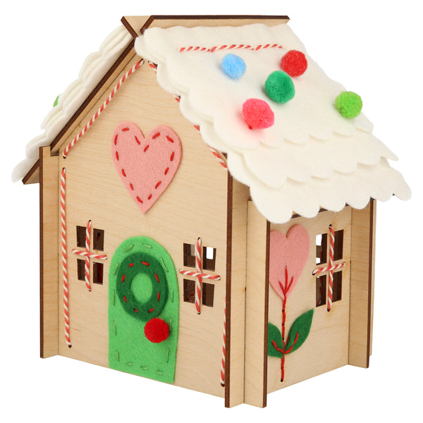 Our wooden gingerbread house features embroidery, felt and pompoms, with wooden reindeer. Perfect as a kids craft project. Image4