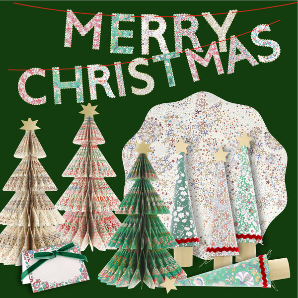 Have yourself a Meri Meri x Liberty Christmas with our sesonal set of place cards, placemats, crackers, 3D trees and a festive garland. Image1