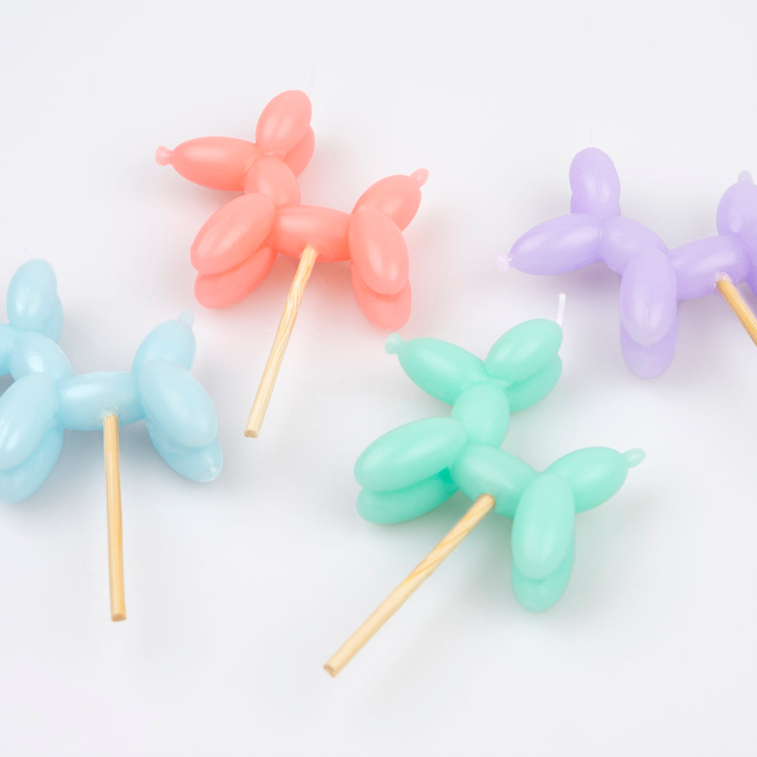 Make your birthday cake decorations look amazing with our fun candles crafted in the shapes of colourful balloon dogs.