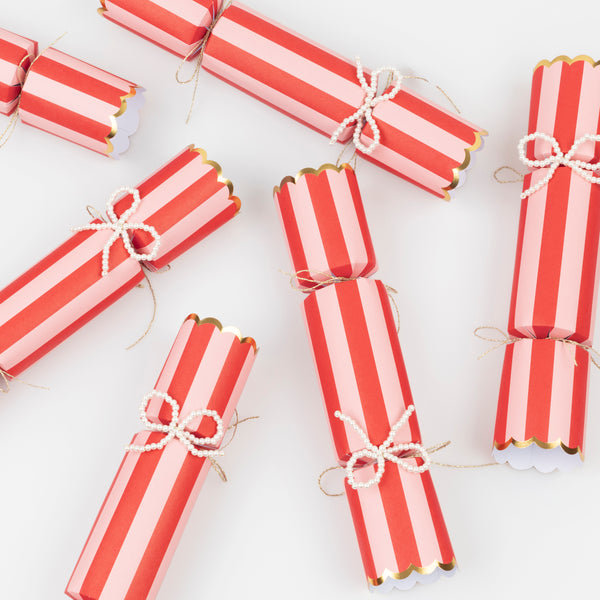 Our Christmas crackers, with bright stripes and faux pearl bow details, which can also be used as tree decorations, contain premium gifts. Image4
