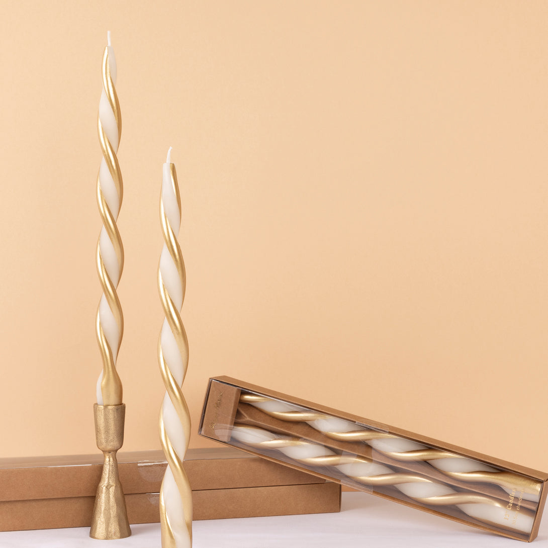 Use our ivory and gold candles, with a stunning twisted design, to add elegance to your Christmas decor. Image1
