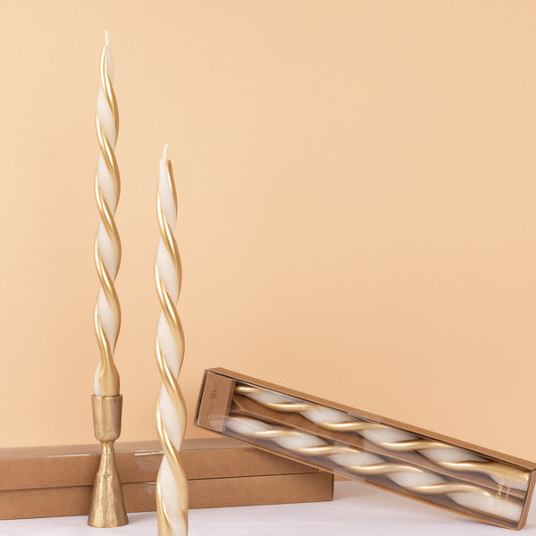 Use our ivory and gold candles, with a stunning twisted design, to add elegance to your Christmas decor. Image1