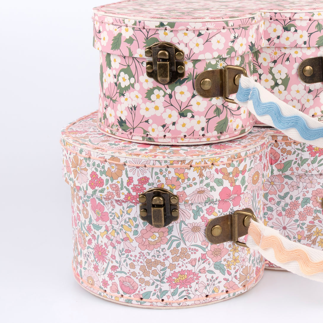 Our mini suitcases feature pretty Liberty floral prints in pink tones, fabulous for kids aged 3+ and adults, for travel and storage.