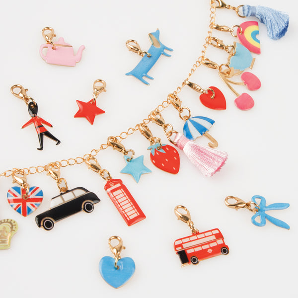 Our iconic Harrods mini suitcase includes an advent calendar where you'll get to create a charm bracelet over 24 days. Image6