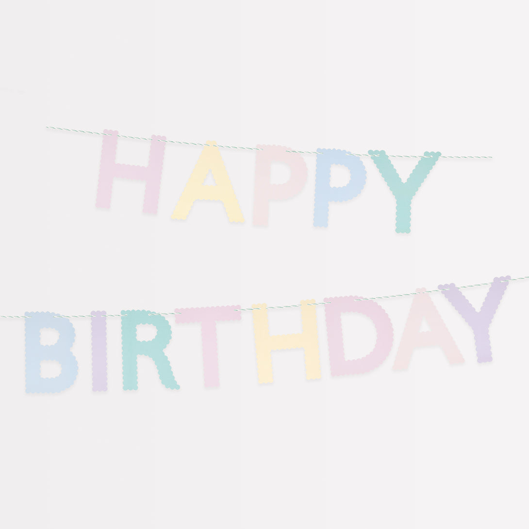 Our paper garland, with the words Happy Birthday in pastel scalloped letters, is the perfect birthday party decoration.