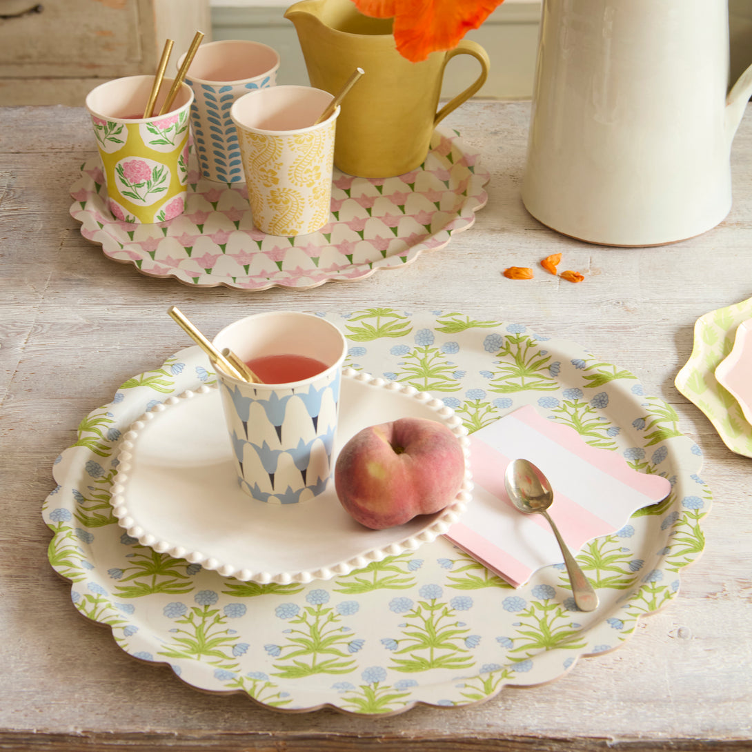 Our small wooden tray, made with birchwood veneer and a melamine coating, has a pretty Molly Mahon floral print.