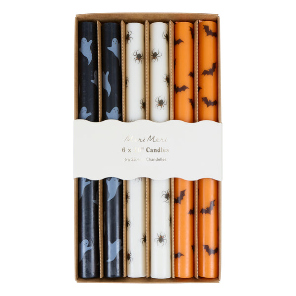 Our tall Halloween candles, in orange, black and white, feature ghosts, bats and spiders, and coloured wicks. Ideal for party decorations. Image4