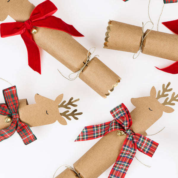 Our Christmas crackers feature reindeer with gold foil antlers and bow details in tartan and velvet, with a joke, party hat and small gift inside. Image3